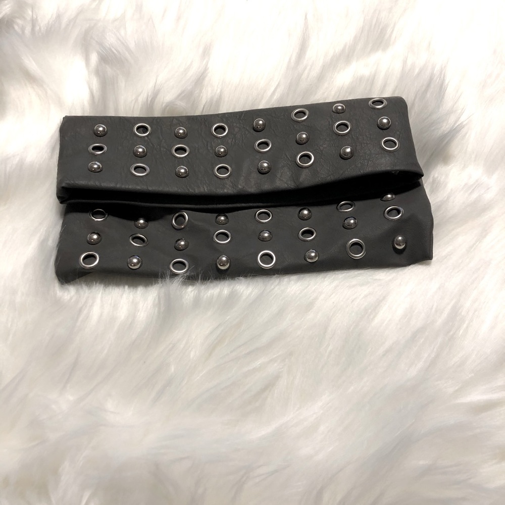 Gray leather clutch purse with silver accents